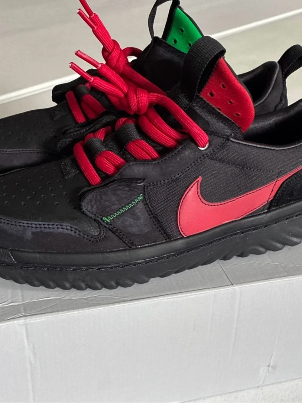 Nike Men’s Black Sneakers with Red Swoosh and Red Laces